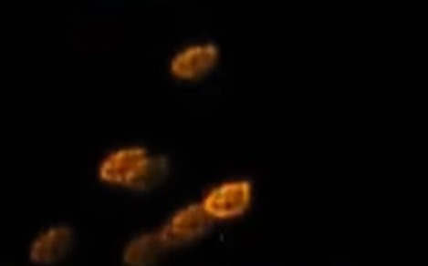 Kathleen Hill caught video of the strange orange circles floating in the sky