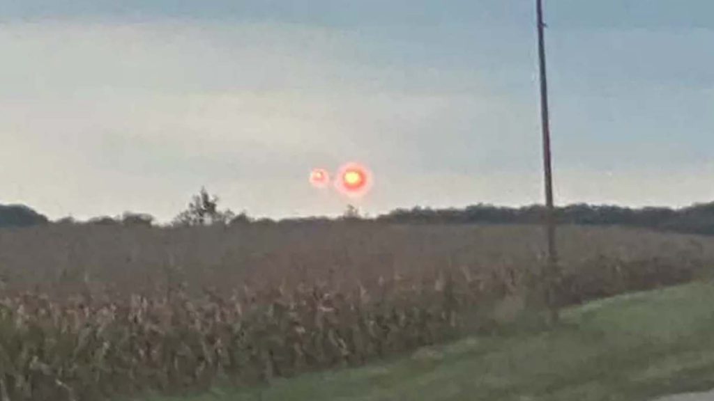 Terrifying video captures ‘pulsing red UFO’ soaring above family driving home from shopping trip
