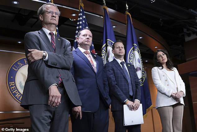 Above, Rep. Tim Burchett (left) next to fellow 'UAP Caucus' member Rep. Eric Burlison during a press conference held by members of the House Oversight committee ahead of a public UFO hearing last July. Both Congressman have compared UFOs to Biblical entities in the past year