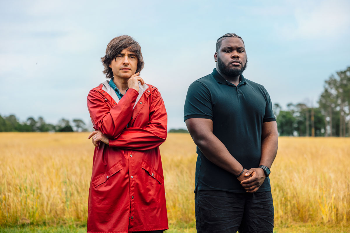 Danny Robins in a field in rural Georgia with the subject of his first investigation for Uncanny USA
