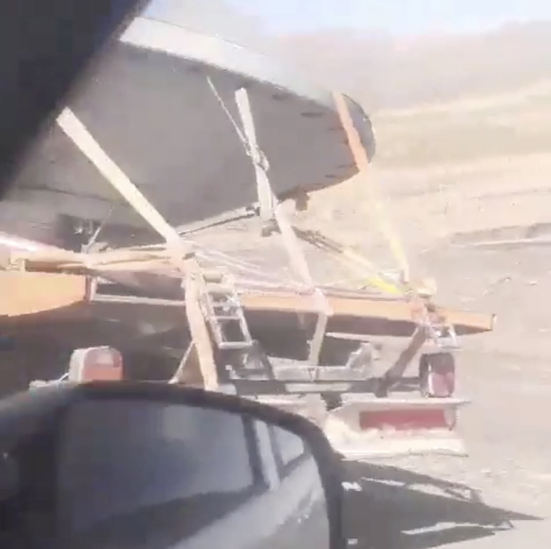 A UFO has been spotted along a highway, shocking passengers who drove beside it