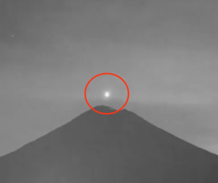 The shining light intensified as it approached the crater before disappearing inside