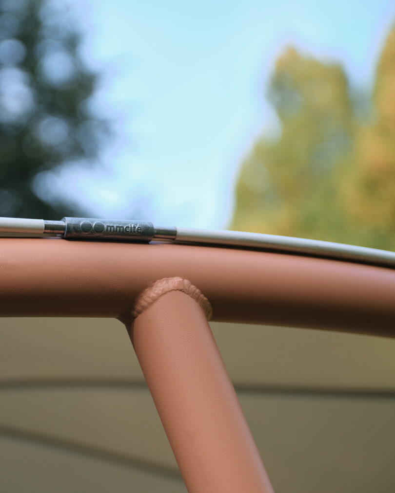 Detail of a modern canopy in a park setting.