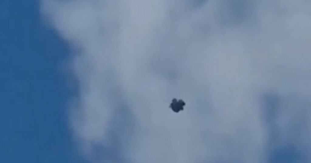 Moment ‘UFO’ flies above UK town as ‘strange’ dark mass spotted in the sky