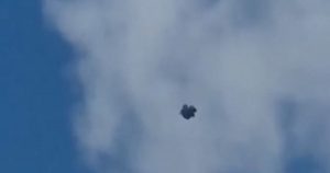 Moment ‘UFO’ flies above UK town as ‘strange’ dark mass spotted in the sky