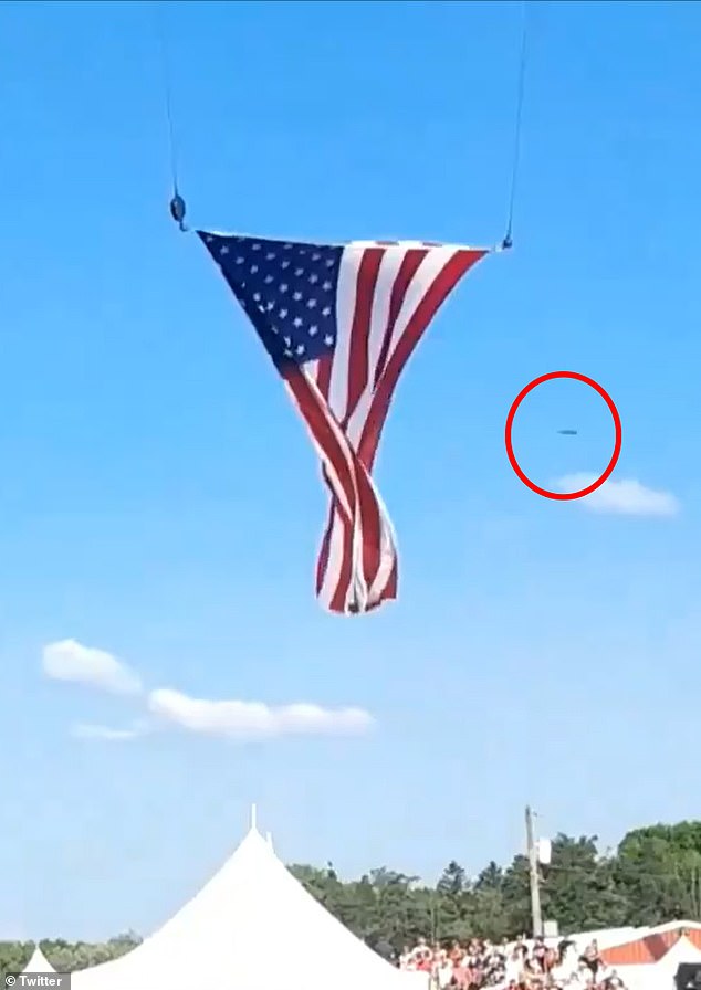 A disc-like object whizzed in the background of an American flag blowing in the wind shortly before bullets were fired and another appeared like an orb as the Secret Service stormed the stage