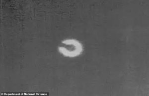 Chilling video shows’ ‘horseshoe-shaped’ UFO defying laws of physics after photo of similar craft shot down over Yukon is declassified