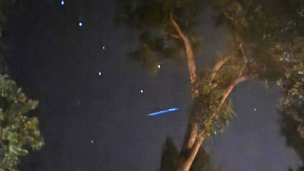 Man captures ‘UFO’ with orange & red ‘rotating lights’ as it silently soars above his home & terrifies his wife