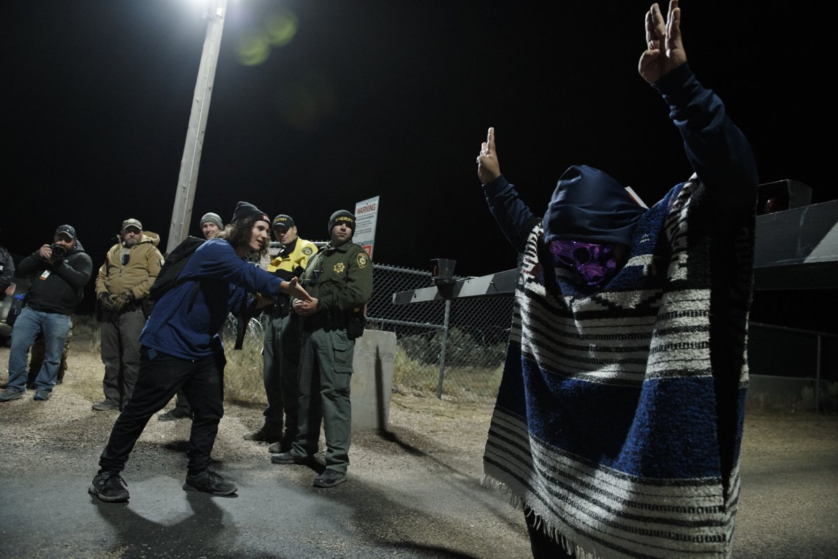 A man poses outside Area 51.