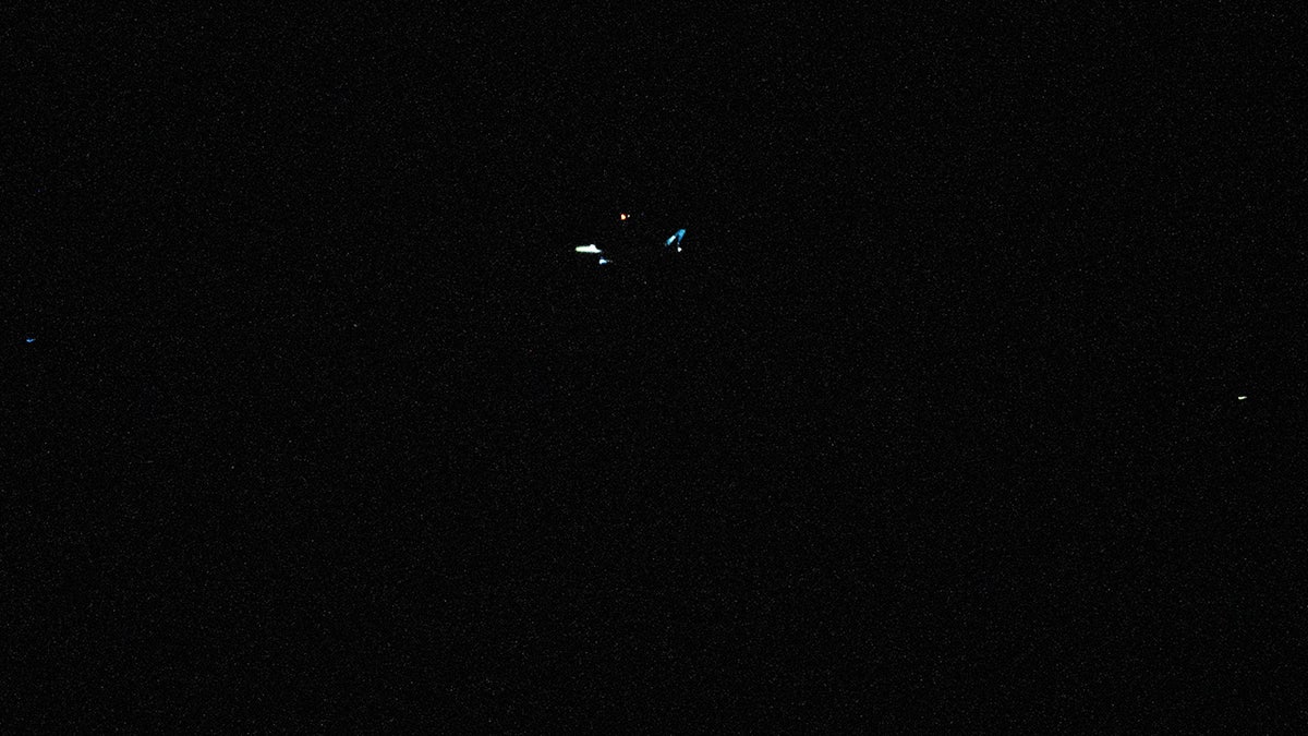 Photos taken in the Bay Shore section of Toms River of what appear to be large drones hovering in the area