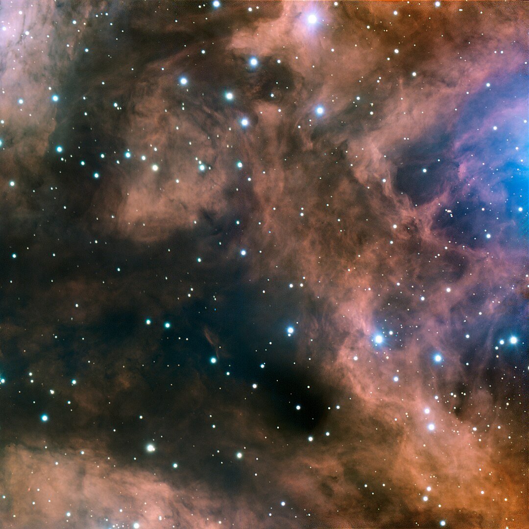 A small part of the emission nebula NGC 6357, part of the interstellar medium. It glows with the characteristic red of an H II region. (Credit : ESO)