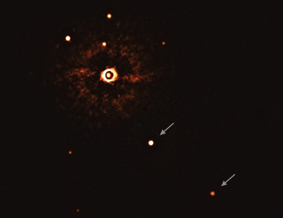 This image, captured by the SPHERE instrument on ESO's Very Large Telescope, shows the star TYC 8998-760-1 accompanied by two giant exoplanets. Credit: ESO/Bohn et al.