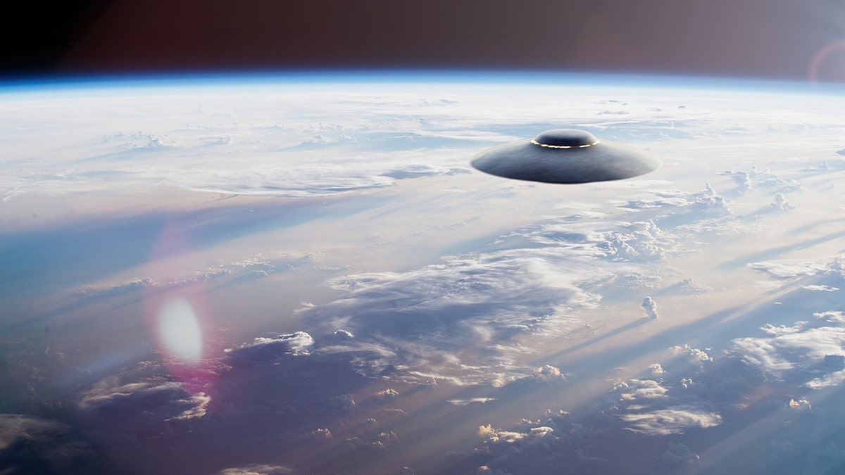 An alien spaceship over the Earth in space