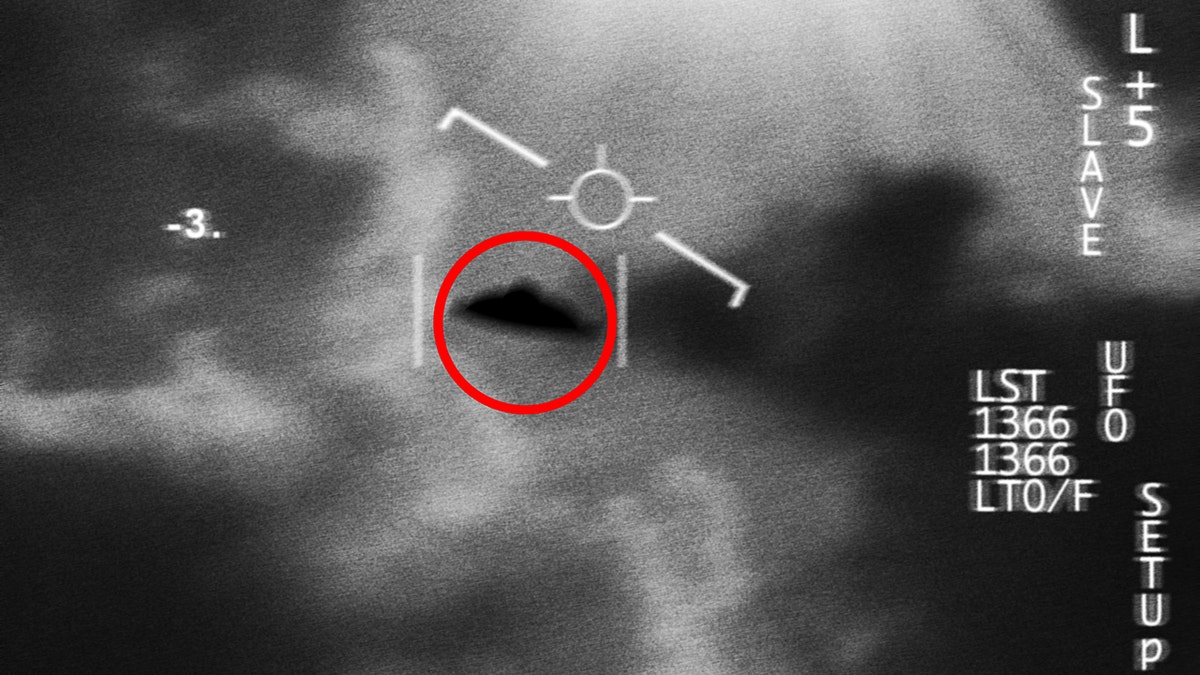 A UFO is circled in red in a black and white surveillance image